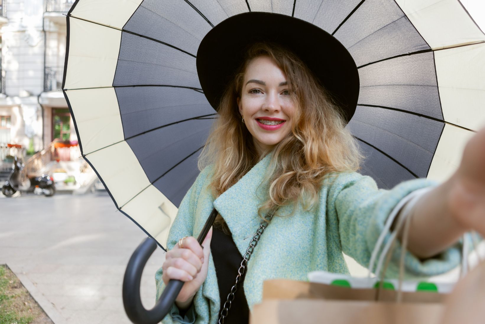 selfie-portrait-attractive-woman-autumn-clothes-with-shopping-bags-umbrella-city